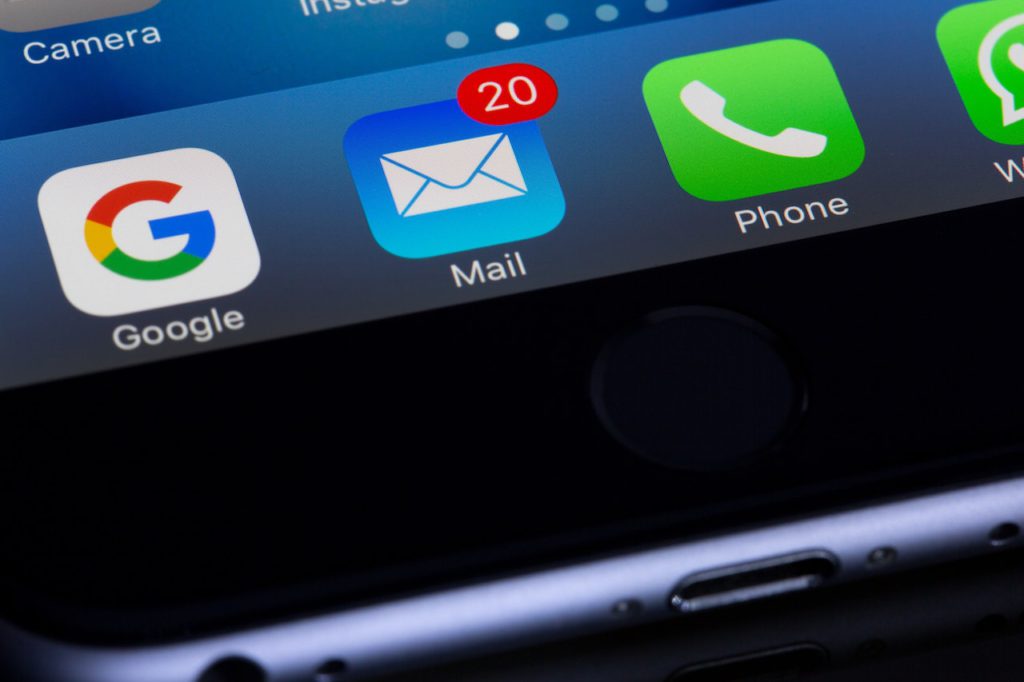 phone screen showing email notifications - trigger emails when the user takes certain in-app actions